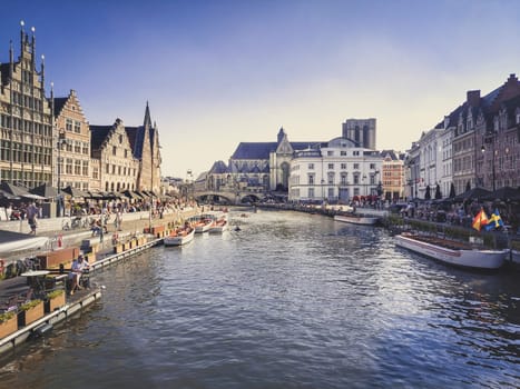 Ghent, Belgium, September 2021: Moody indian summer atmosphere at Graslei in Ghent.