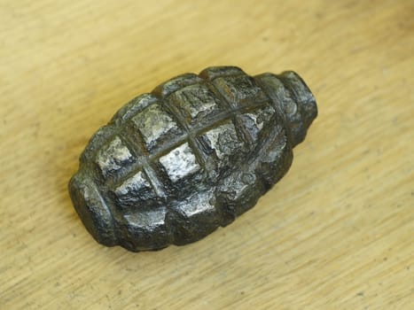 old rusty hand grenade military artifact close-up