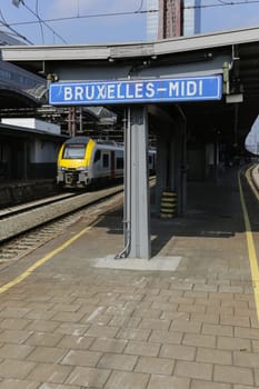 Rail tracks and trains in the Brussels South Railway Station