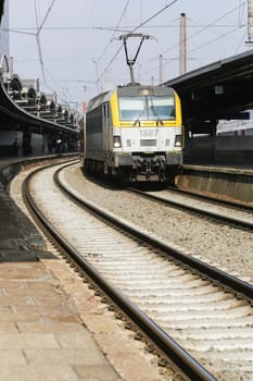 Rail tracks and trains in the Brussels South Railway Station