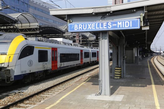 Rail tracks and trains in the Brussels South Railway Station