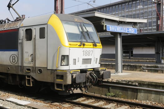 Rail tracks and trains in the Brussels South Railway Station
