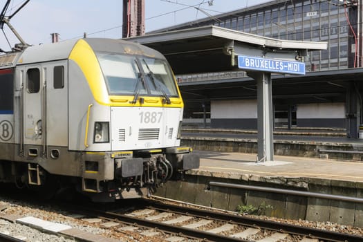 Rail tracks and trains in the Brussels South Railway Station