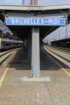 Rail tracks and trains in the Brussels South Railway Station