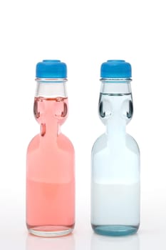 Soda drink Ramune in a bottle on white background