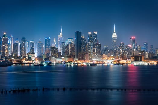 New York City skyline with urban skyscrapers at sunset, USA.