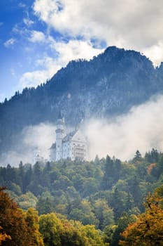 Scenic view of the Neuschwanstein Castle in morning fog