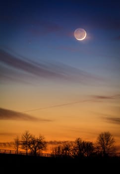 Scenic view of young crescent moon over rural Kentucky