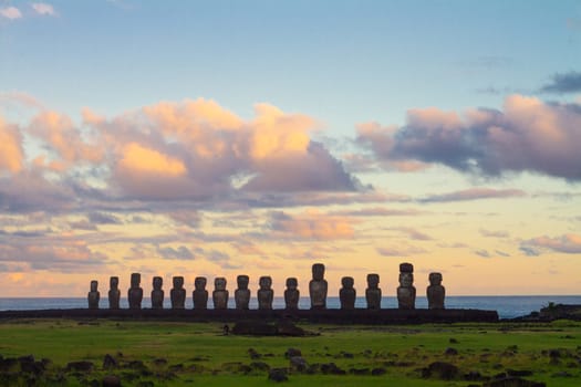 Dramatic colorful sunrise over Moai stone sculptures at Ahu Tongariki, Easter island, Chile