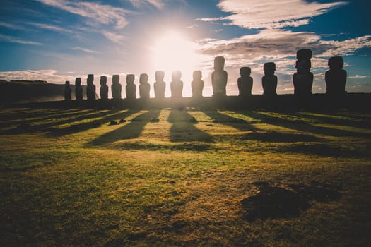 Sunrise over Moai stone sculptures at Ahu Tongariki, Easter island, Chile