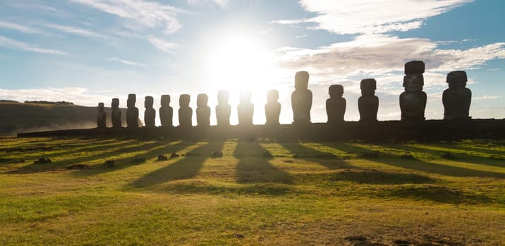 Sunrise over Moai stone sculptures at Ahu Tongariki, Easter island, Chile