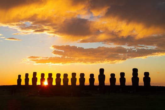 Dramatic colorful sunrise over Moai stone sculptures at Ahu Tongariki, Easter island, Chile