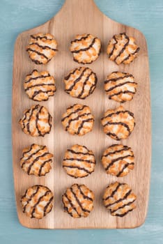 Coconut macaroons on a textured blue background