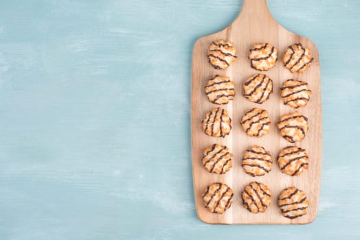 Coconut macaroons on a textured blue background