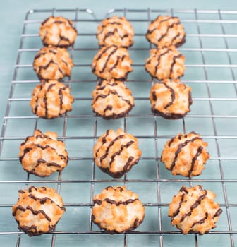 Coconut macaroons on a textured blue background