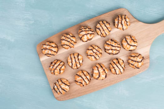 Coconut macaroons on a textured blue background