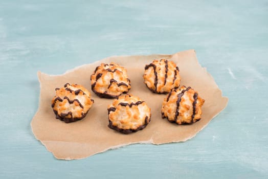 Coconut macaroons on a textured blue background