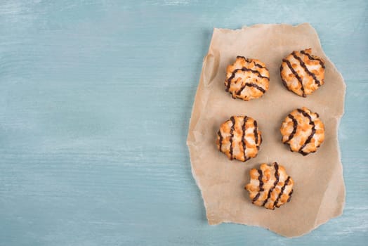 Coconut macaroons on a textured blue background