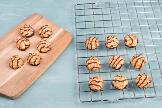 Coconut macaroons on a textured blue background