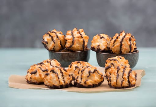 Coconut macaroons on a textured blue background