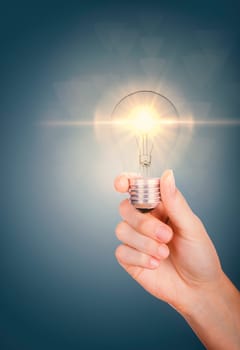 Good ideas with innovation and creativity concept. Young women hand holding lightning bulb