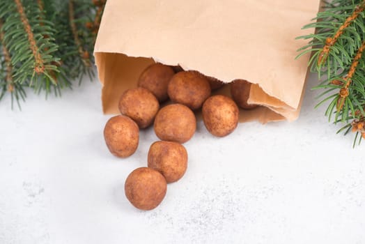 Marzipan potatoes, in german called Marzipankartoffeln, with cacao powder, sweets for christmas, empty copy space