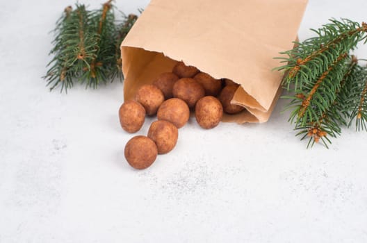 Marzipan potatoes, in german called Marzipankartoffeln, with cacao powder, sweets for christmas, empty copy space