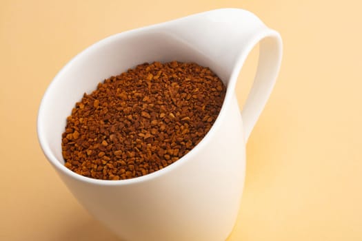 Powdered Coffee in a beautiful Coffee Cup on beige background