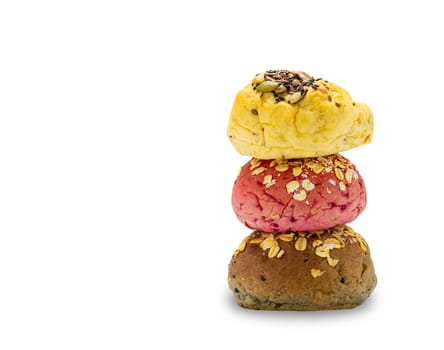 Stack of homemade veggie burger whole wheat buns bread of pumpkin, beetroot and black sesame with cereal and sesame seeds isolated on white background