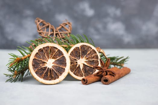 Christmas items like dried oranges, hazelnuts, fir branch, empty copy space