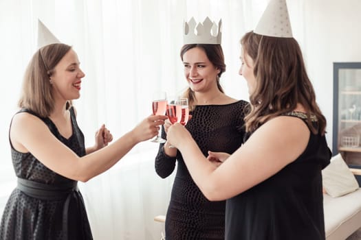 Celebration. Hands holding the glasses of champagne and wine making a toast.