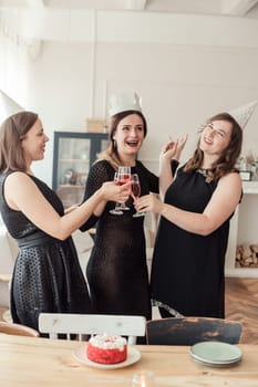 Celebration. Hands holding the glasses of champagne and wine making a toast.