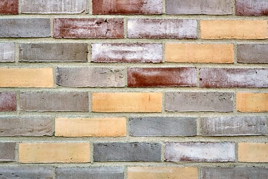 Background from a multicolored brick wall