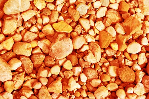 Many orange and yellow pebbles