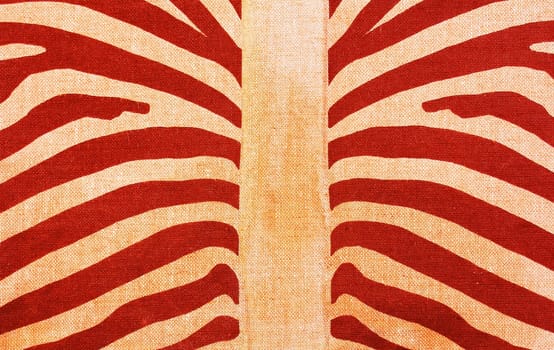 Close up of textile fabric with red and orange zebra stripes