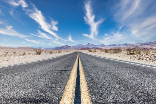 Route 66 in the desert with scenic sky. Classic vintage image with nobody.