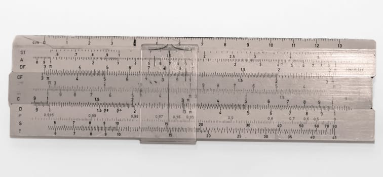 Picture of an old slide rule from GDR times that the students used. Antique calculator.