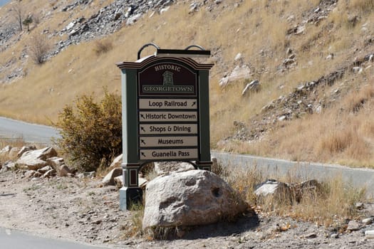 Georgetown, CO, USA - October 8, 2020: Historic Georgetown road sign showing directions of various travel destinations. Road sign on Brownell Street showing directions to various local tourist places.