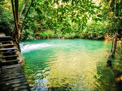 Huay Mae Khamin waterfall in Kanchanaburi, Thailand South east asia Jungle landscape with amazing turquoise water of cascade waterfall at deep tropical rain forest. travel landscape and destinations