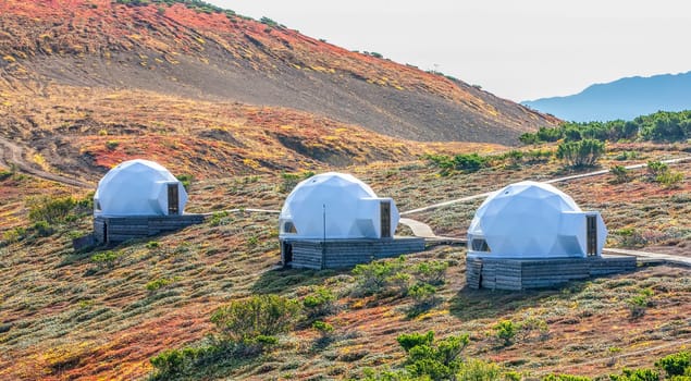 The White glamping on the slope of a volcano in autumn on the Kamchatka Peninsula