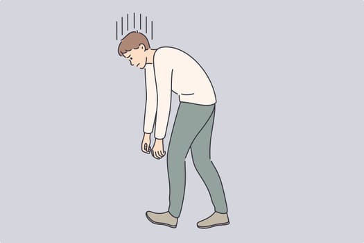 Overwork, tiredness, exhaustion at work concept. Young tired stressed businessman cartoon character walking with hand and back down vector illustration