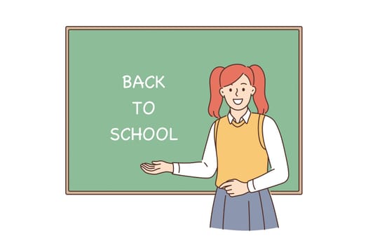 Back to school and learning concept. Young smiling girl pupil cartoon character standing near blackboard with lettering on it showing excitement vector illustration