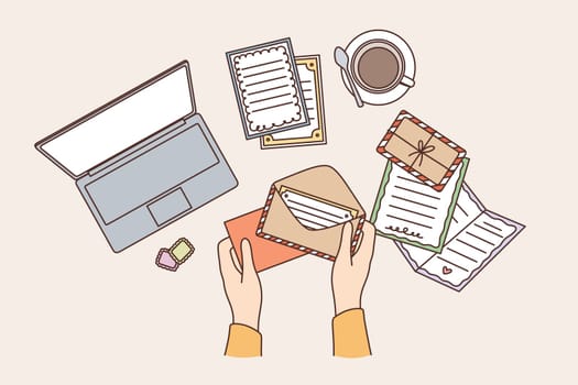 Workplace space and table concept. Top view of human hands sending postcard in envelope on working table vector illustration