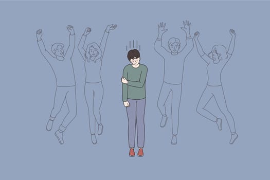 Loneliness in society and crowd concept. Upset young lonely man cartoon character standing alone among human crowd feeling alone lost vector illustration