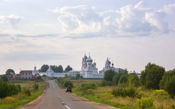 Pereslavl-Zalessky, Russia - August 10, 2021: The road leading to the Nikitsky Monastery - one of the most ancient monasteries of Russia, founded in the 12th century. Orthodox male monastery is part of the Pleshcheyevo Lake National Park.