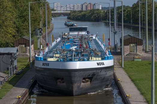 Cargo ship at the entrance to the Frankfurt-Griesheim lock, Germany
