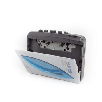 Sony Walkman. Vintage portable audio tape compact cassette player with headphones and cassette. Device on white background. Bergamo, ITALY - March 24, 2021.