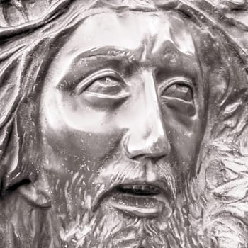 Bas-relief of Jesus crowned with thorns. High relief face of Jesus Christ with crown of thorns.