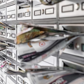 mailboxes filled of leaflets. Business and advertising concepts. Shallow dof.