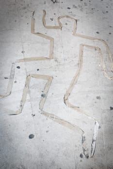 Dead body silhouette on ground made with scotch tape. Crime scene concept.